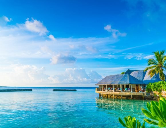 Beautiful water villas in tropical Maldives island at the sunrise time